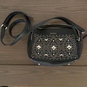 Calvin clean cross body purse. Black and silver